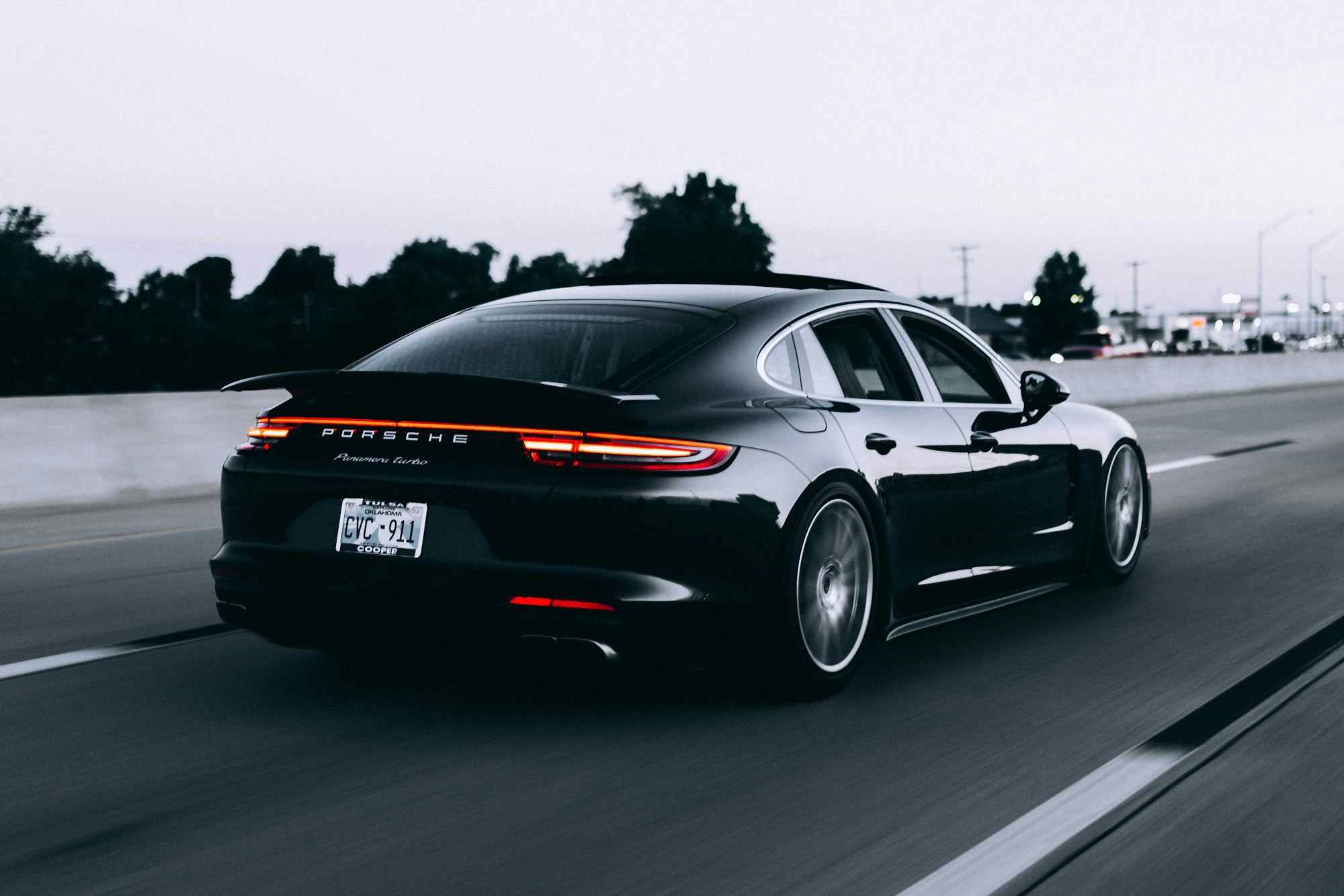 Black performance car in motion